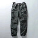 Green cargo pants on a light gray background, Obroi