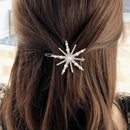 Hair accessory with star design on a person's hair, Obroi