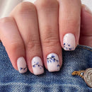 Nails with floral design on a denim background, Obroi
