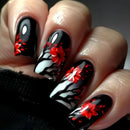 Nails with black, white, and red floral design on a dark background, Obroi