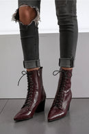 Maroon lace-up boots worn with rolled-up jeans on a neutral background, Obroi