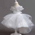 White sparkly dress on a mannequin against a dark background, Obroi