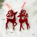 Red reindeer ornaments with gold details on a snowy background, showing measurements and weight, Obroi