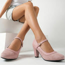 Person wearing pink high-heeled shoes with a white background, Obroi