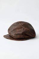 Brown leather cap on a white background, Obroi