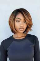 Woman with a styled bob haircut against a light blue background, Obroi