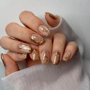 Nails with gold accents on a white background, Obroi