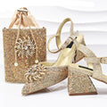 Gold glittery handbag and high-heeled shoes on a white background, Obroi