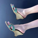 Woven wedge sandals with green straps on a dark background, Obroi
