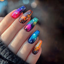Nails with galaxy design in various colors on a blurred background, Obroi
