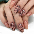 Nails with leopard print design on a white background, Obroi