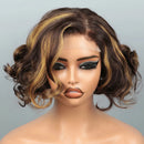 A short wavy wig with dark brown and golden blonde highlights, styled on a mannequin head against a light gray background. A watermark reading 'Obroi' and a color code label 'Obroi' are overlaid on the image.