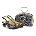 A matching black embellished slingback shoe and structured handbag set, both covered in silver beadwork with gold-tone hardware and a floral motif on the bag, shown on a white background, Obroi