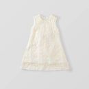 An off-white sleeveless baby dress with delicate floral embroidery, shown flat on a light gray background, Obroi