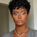 Woman with short black hair and dramatic makeup wearing a gray cardigan, Obroi