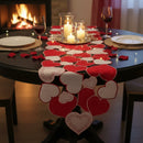 Dining table set for a romantic dinner with heart-shaped decorations, candles, and wine glasses in front of a fireplace, Obroi