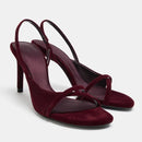 Pair of maroon high-heeled sandals on a light gray background, Obroi