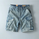 Light blue denim cargo shorts on a gray background, Obroi