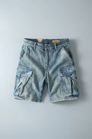 Light blue denim cargo shorts on a gray background, Obroi