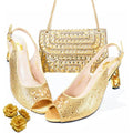 Gold high-heeled shoes and matching handbag on a white background, Obroi