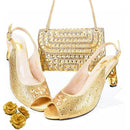 Gold high-heeled shoes and matching handbag on a white background, Obroi