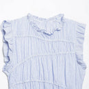 A close-up of a sleeveless top with vertical blue and white stripes, featuring ruffled trim at the neckline and ruffled cap sleeves, laid flat against a white background, Obroi