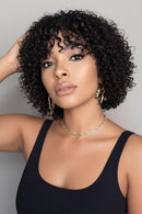 Woman with styled hair against a neutral background, Obroi