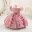 Pink dress on a mannequin against a white background