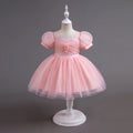 Pink dress on a mannequin against a gray background, Obroi