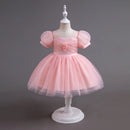 Pink dress on a mannequin against a gray background, Obroi