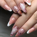 Close-up of hands with pink and white nail polish on a dark background ,Obroi