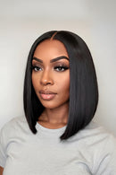 Woman with a stylish black bob haircut against a plain background, Obroi