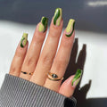 Nails with green and beige gradient design on a neutral background, Obroi