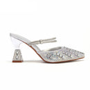 Silver embellished high-heeled shoe on a white background with 'Obroi' branding.