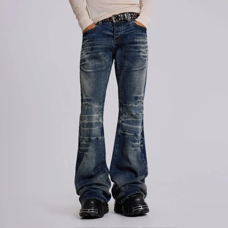 Obroi Person wearing blue flared jeans on a plain background