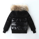 A black puffer jacket with horizontal quilting, ribbed cuffs and hem, and a large fluffy beige faux-fur trimmed hood, shown from the back on a white background, Obroi