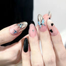 Nails with butterfly designs on a neutral background, Obroi