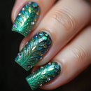 Nails with peacock feather design and glitter on a dark background, Obroi