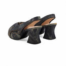 Pair of dark denim high-heeled shoes on a white background, Obroi