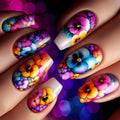 Close-up of manicured fingernails decorated with colorful floral nail art featuring purple, blue, pink, orange, and yellow flowers on a dark blurred background, Obroi
