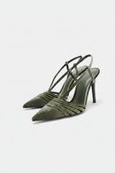 Green high-heeled shoes with strappy design on a white background, Obroi