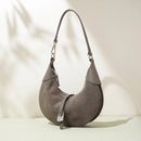 Gray handbag on a light beige background, Obroi