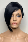 Black wig on a mannequin head against a plain background, Obroi