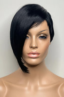 Black wig on a mannequin head against a plain background, Obroi