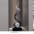 Obroi decorative glass sculpture with wavy design on a gray background