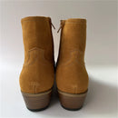 Pair of tan suede ankle boots on a white background, Obroi