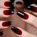 Close-up of hands with red and black nail polish on a blurred background, Obroi