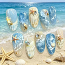 Nail art with seashells and starfish on a beach setting, Obroi