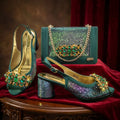 Teal high-heeled shoes with gemstone embellishments and a matching handbag on a red fabric background, Obroi