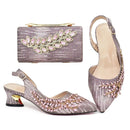 Pair of embellished shoes with matching handbag on a white background, Obroi